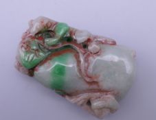 A carved jade pendant. 5.5 cm high.