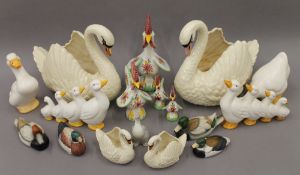 A collection of porcelain swans, ducks and chickens. Large swans 38 cm high, 36 cm long.