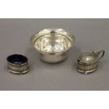 A silver bowl and a silver mustard and salt. The former 11 cm diameter. 2.9 troy ounces.