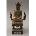 A bronze seated Chinaman. 32.5 cm high.