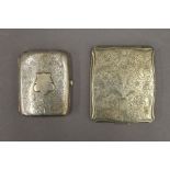 A silver cigarette case and an Alpaca cigarette case. The former 6 cm wide.