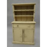 An early 20th century miniature pine dresser. 76 cm high.