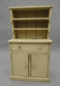 An early 20th century miniature pine dresser. 76 cm high.