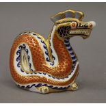 A Royal Crown Derby paperweight formed as a dragon.