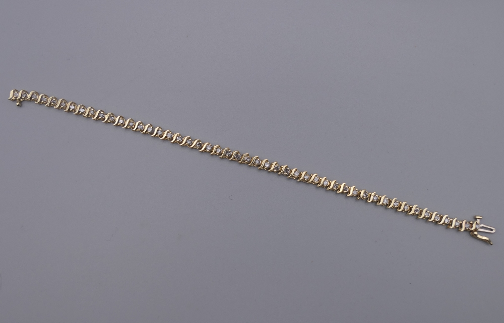 A 14 K gold diamond tennis bracelet with forty-seven diamonds, 0. - Image 4 of 9