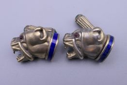 A pair of silver dog form cufflinks, bearing Russian marks. 2.5 cm long.