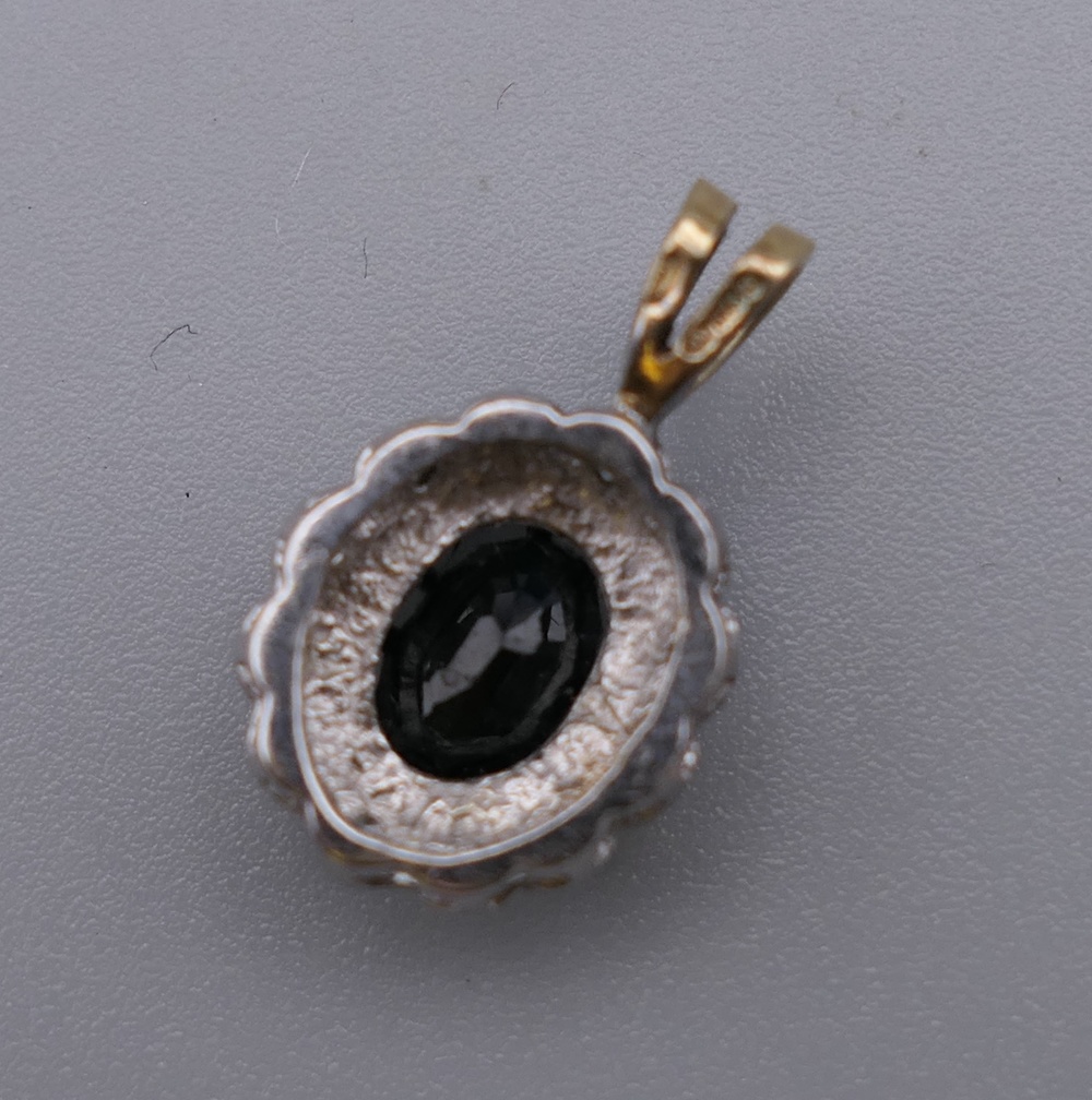 A 9 ct gold sapphire and diamond pendant. 1.75 cm high. - Image 3 of 3