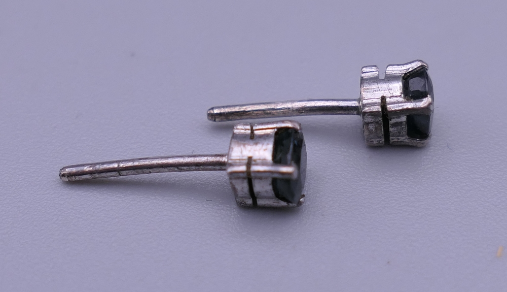 A pair of white gold and sapphire ear studs. Each 4 mm high. - Image 2 of 4