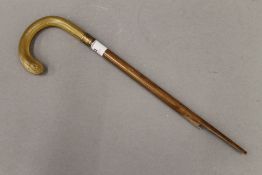 A Victorian horn cane handle, possibly rhino horn. The handle 7 cm high.