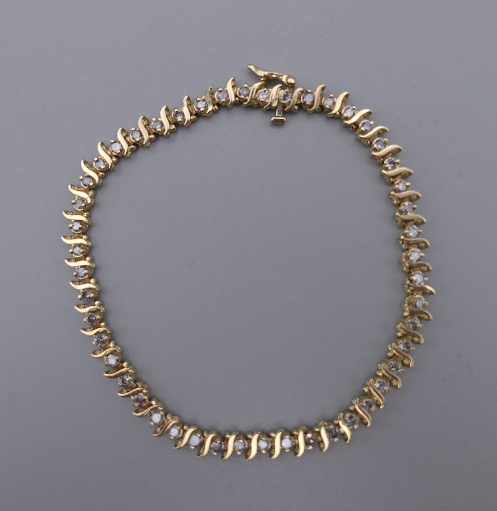 A 14 K gold diamond tennis bracelet with forty-seven diamonds, 0. - Image 2 of 9