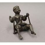 A Japanese bronzed metal figure. 18 cm high.