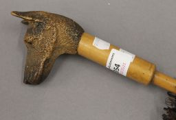 A Swaine and Adeney Limited umbrella with carved dog's head handle. 67.5 cm long.