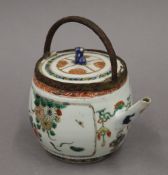 A 17th/18th century Chinese porcelain tea pot, with adapted handle. 13 cm high.