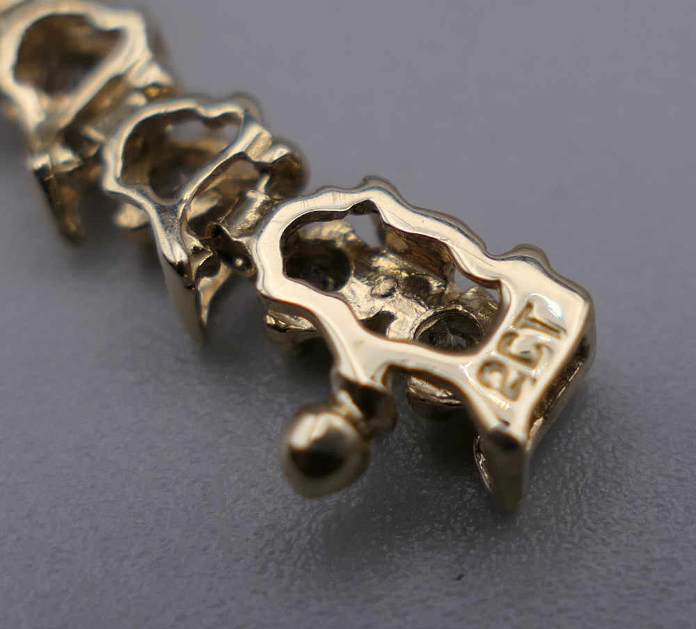 A 14 K gold diamond tennis bracelet with forty-seven diamonds, 0. - Image 7 of 9