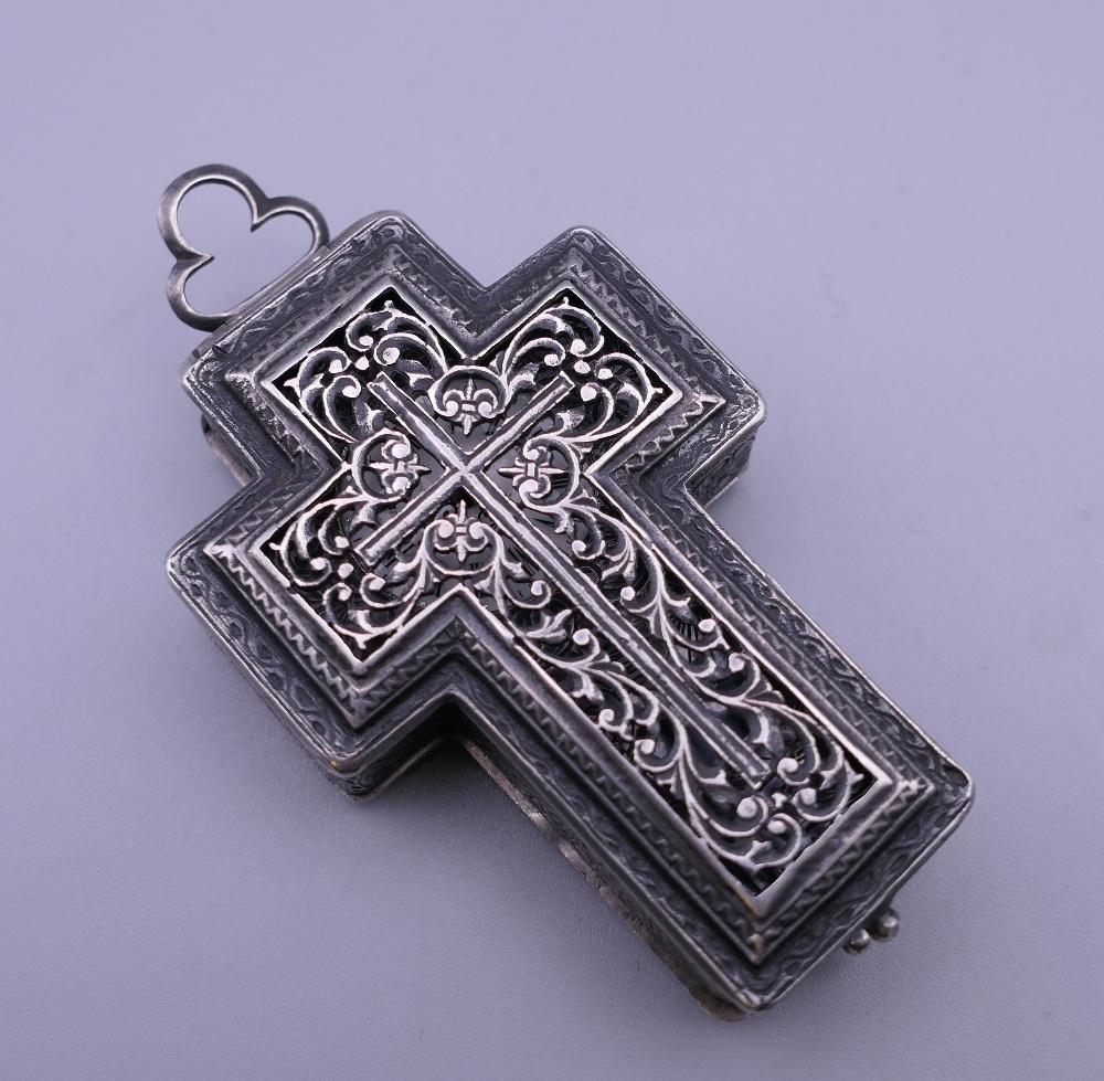 A 19th century unmarked white metal cross form pendant watch. 8 cm high. - Image 2 of 11