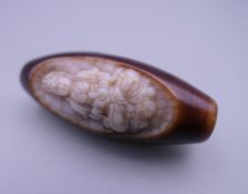 A carved Zhi bead. 5 cm high.