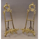 A pair of brass table easels. 41 cm high.