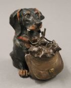 A painted bronze dog form inkwell. 11 cm high.
