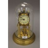 A Gustav Becker 400 day clock under glass dome. 28 cm high.