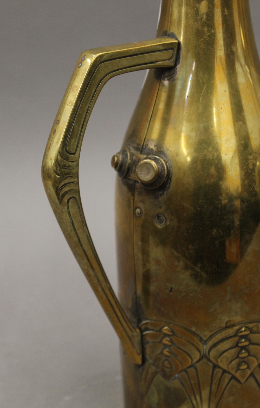 A W.M.F Arts and Crafts brass bottle cover. 29 cm high. - Bild 3 aus 5