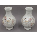 A pair of 19th century Chinese or Japanese porcelain vases. Each 22 cm high.