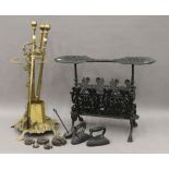 A brass stick stand, a set of brass fire irons and a cast iron fire side stand.