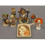 A collection of Hummel and Goebel porcelain figures