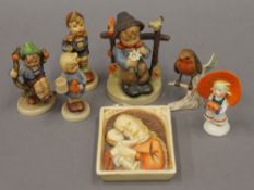 A collection of Hummel and Goebel porcelain figures