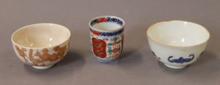 Three porcelain tea bowls. The largest 8 cm diameter.