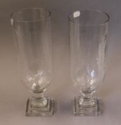 A pair of cut glass storm lamps. 34 cm high.