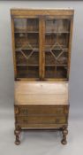 An early 20th century oak bureau bookcase. 76 cm wide.