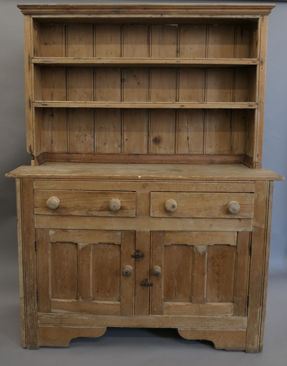 A Victorian pine dresser. 138 cm wide, 180 cm high.
