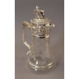 A silver plated lion top claret jug. 27 cm high.