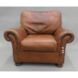 A modern leather armchair. 97 cm wide.