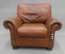 A modern leather armchair. 97 cm wide.