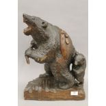A Japanese carved wooden bear, signed. 46 cm high.