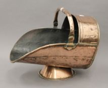 A Victorian copper coal scuttle.