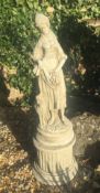 A garden statue of a shepherdess. 80 cm high.