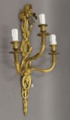 A gilt bronze three-branch wall light. 67 cm high.