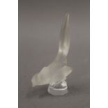 A small Lalique frosted glass bird, marked Lalique France. 9.5 cm high.