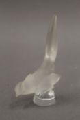 A small Lalique frosted glass bird, marked Lalique France. 9.5 cm high.