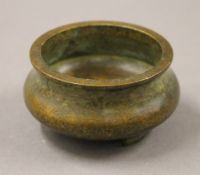 A small Chinese bronze censer. 8 cm diameter.