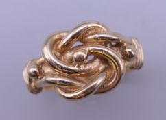 A 9 ct gold gentleman's Celtic knot ring. Ring size S. 5.7 grammes.