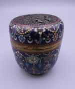 A 19th century Chinese cloisonne box of ovoid form. 7 cm high.