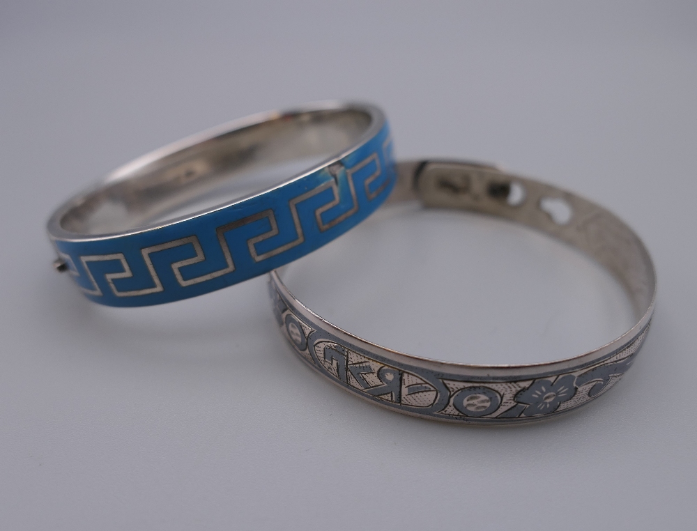 An antique silver and blue enamel Greek pattern design bracelet and a Russian silver and niello