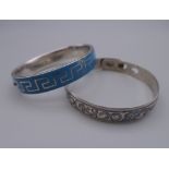 An antique silver and blue enamel Greek pattern design bracelet and a Russian silver and niello