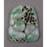 A large jade pendant. 9 cm high.