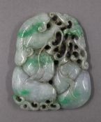 A large jade pendant. 9 cm high.