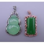 Two jade pendants. The largest 5.5 cm high.