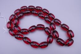 A dress bead necklace. Approximately 80 cm long.